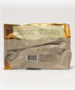 Pacote de chá mate magna em fundo cinza claro de costas. Pacote com tons de marrom com laranja. Modo de preparo disponível na descrição do produto.